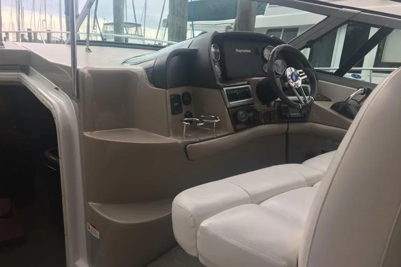 Slide: The Image of Interior cockpit of 2006 Four Winds Vista 348 boat with steering wheel and controls. - 13