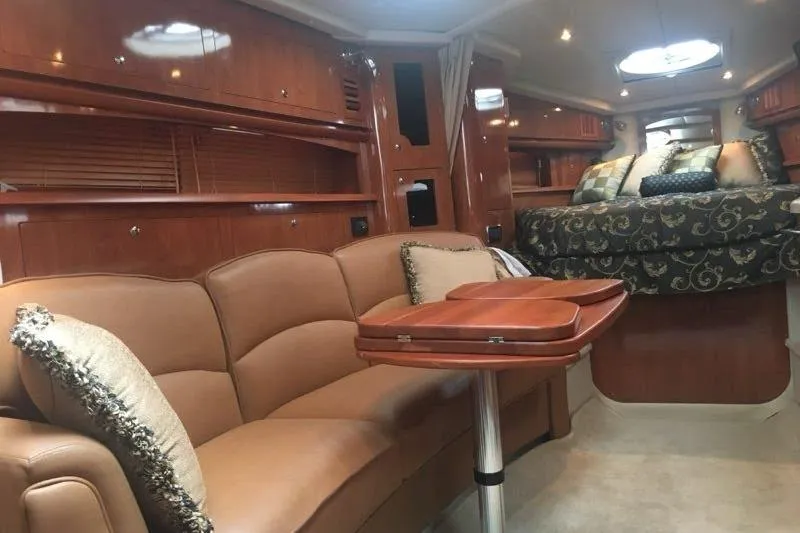 Slide: The Image of Luxurious interior of 2006 Four Winds Vista 348 RV with elegant seating and bedding. - 15