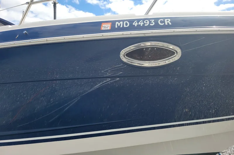 Slide: The Image of 2006 Four Winds Vista 348 boat with blue hull and registration number MD 4493 CR. - 2