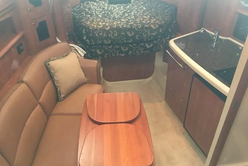 Slide: The Image of Interior of 2006 Four Winds Vista 348 yacht with sofa, table, and kitchenette. - 20