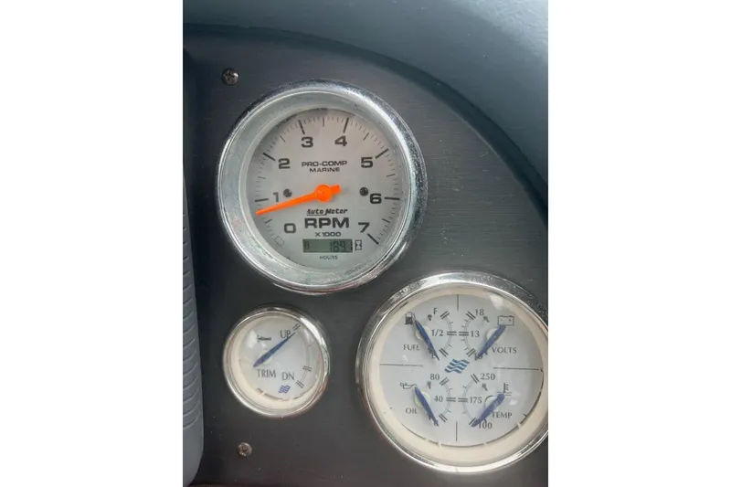 Slide: The Image of Close-up of 2006 Four Winds Vista 348 boat gauges, displaying RPM, trim, fuel, volts, oil, and temperature. - 23