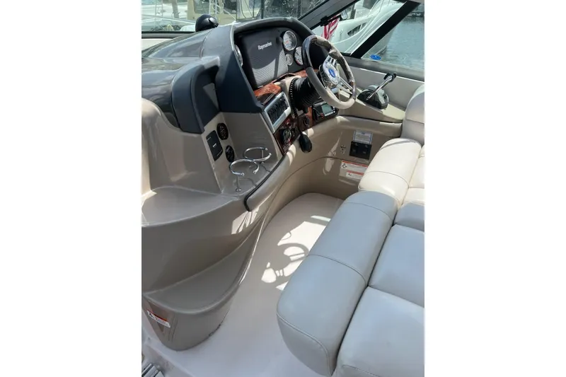 Slide: The Image of Interior cockpit of 2006 Four Winds Vista 348 boat with steering wheel and controls. - 24