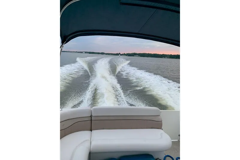 Slide: The Image of Rear view from a 2006 Four Winds Vista 348 boat, showing wake trails on the water. - 30