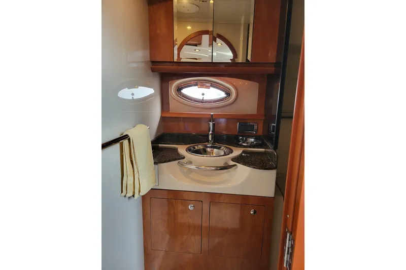 Slide: The Image of Luxurious bathroom interior of 2006 Four Winns 348 Vista yacht with wood cabinetry. - 35