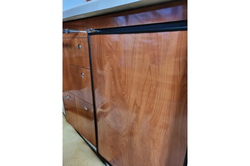 Slide: The Image of Wooden cabinetry in 2006 Four Winns 348 Vista boat interior. - 36