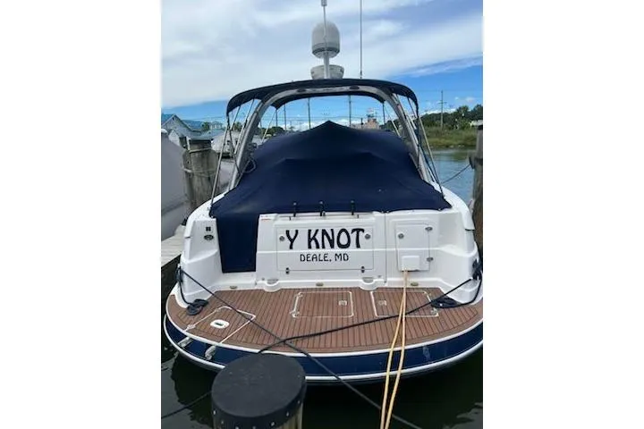 Slide: The Image of 2006 Four Winds Vista 348 boat docked, rear view with "Y Knot" name visible. - 4