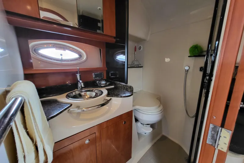 Slide: The Image of Luxurious 2006 Four Winns 348 Vista yacht bathroom with modern fixtures and elegant wood cabinetry. - 40