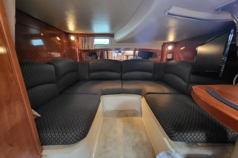 Slide: The Image of Luxurious interior of 2006 Four Winns 348 Vista yacht with plush seating and elegant wood finishes. - 41