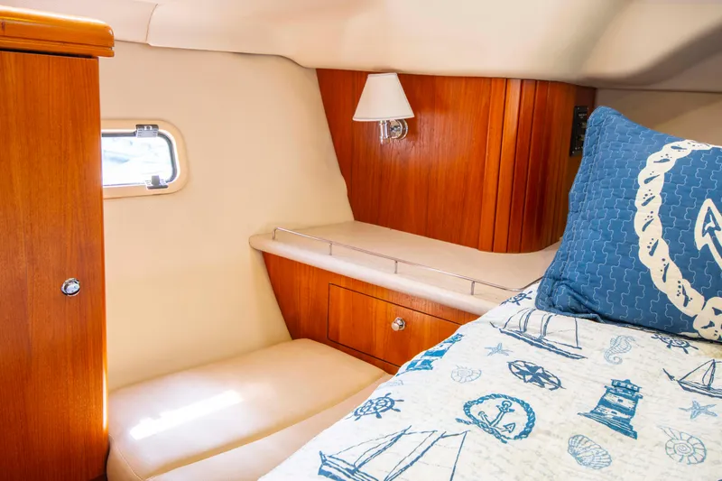 Slide: The Image of Cozy cabin interior of 2005 Hunter 45 CC sailboat with nautical-themed bedding. - 22