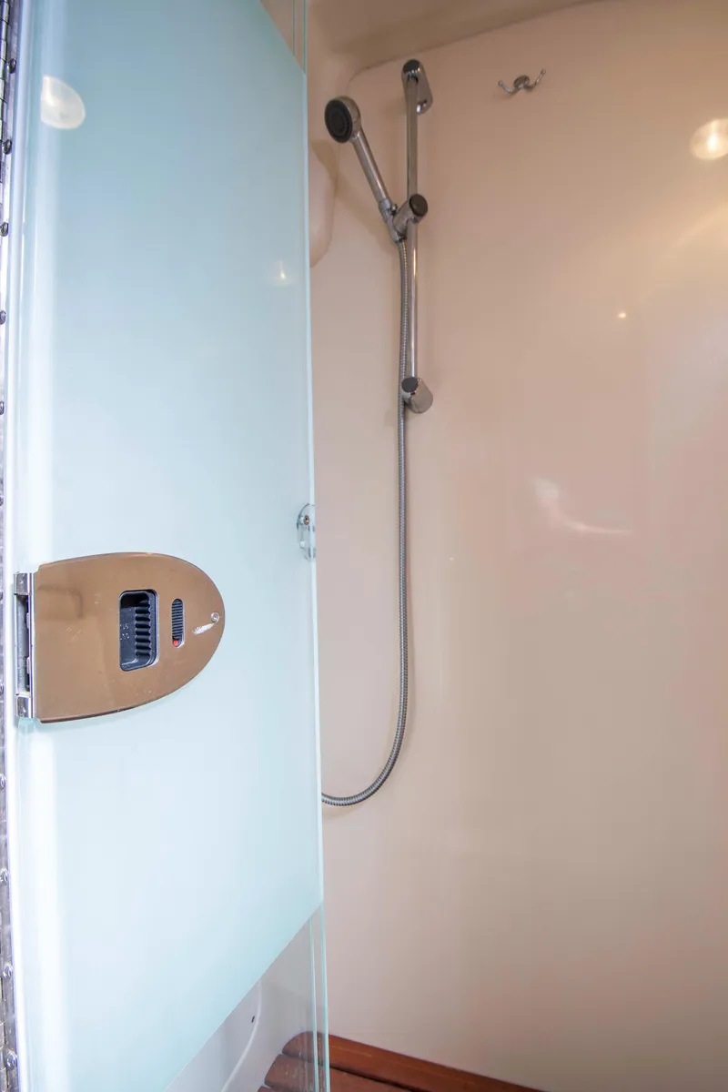 Slide: The Image of Shower area in 2005 Hunter 45 CC yacht with glass door and modern fixtures. - 28