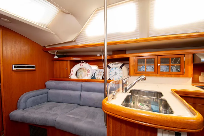Slide: The Image of Interior of 2005 Hunter 45 CC yacht with cozy seating and kitchen area. - 32