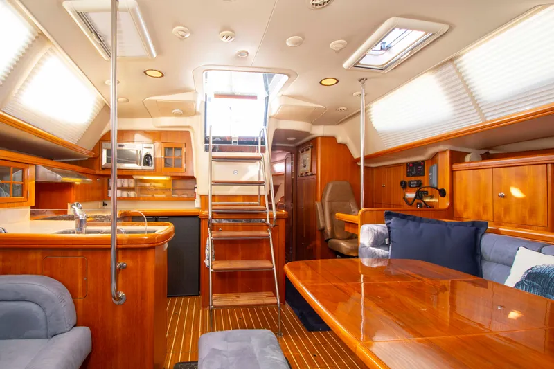 Slide: The Image of Luxurious interior of a 2005 Hunter 45 CC yacht with wooden finishes and modern amenities. - 33