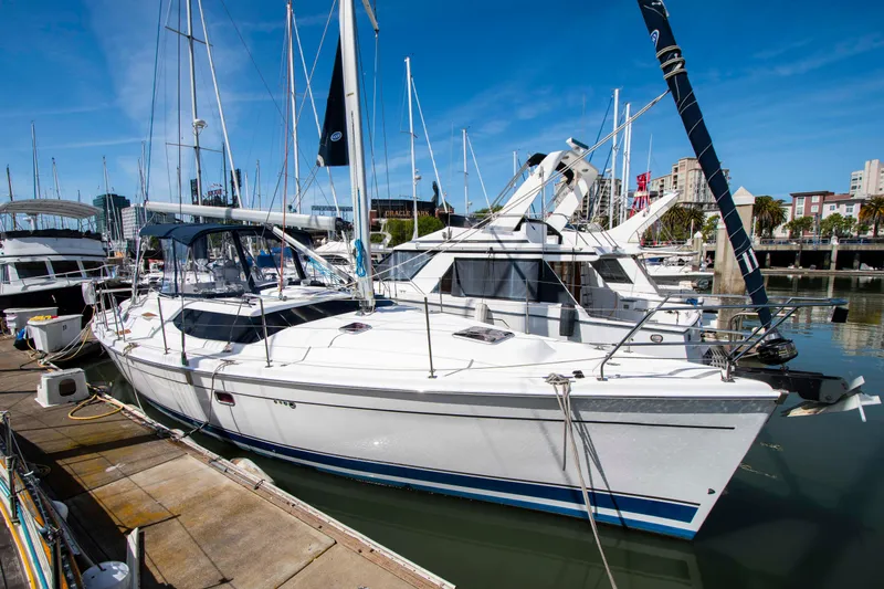 Slide: The Image of 2005 Hunter 45 CC sailboat docked at marina under clear blue sky. - 7
