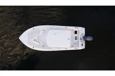 Slide: The Image of Aerial view of a 2021 Sea Hunt Ultra 229 boat on dark water. - 22