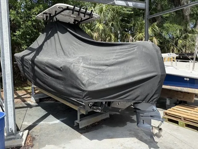 Slide: The Image of Covered Sea Hunt Ultra 229 boat, 2021 model, on a trailer. - 27