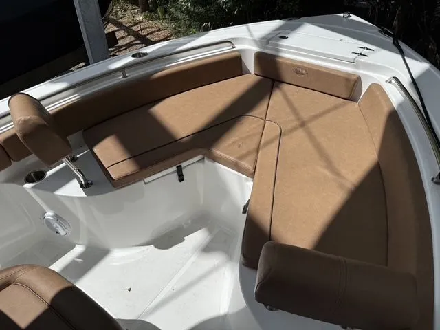 Slide: The Image of Interior view of a 2021 Sea Hunt Ultra 229 boat with brown seating. - 29