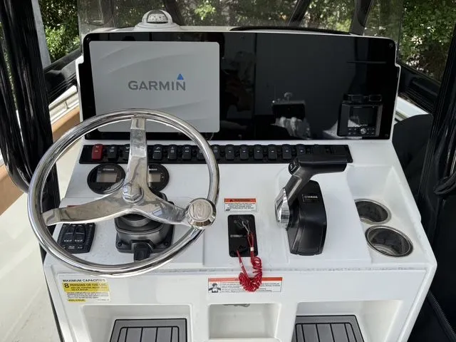 Slide: The Image of Sea Hunt Ultra 229 boat console with Garmin navigation system. - 32