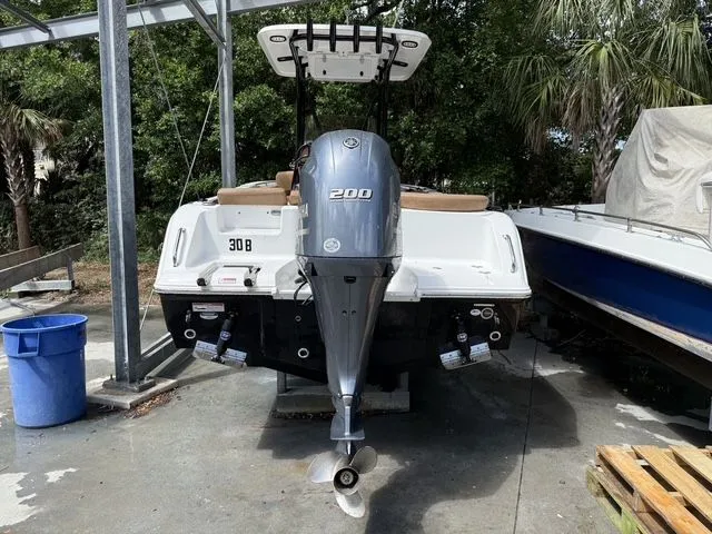Slide: The Image of 2021 Sea Hunt Ultra 229 boat with outboard motor. - 38