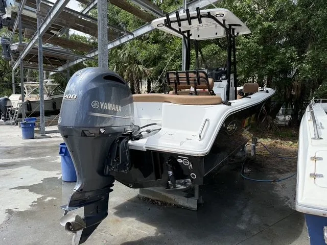 Slide: The Image of 2021 Sea Hunt Ultra 229 boat with Yamaha engine outdoors. - 39
