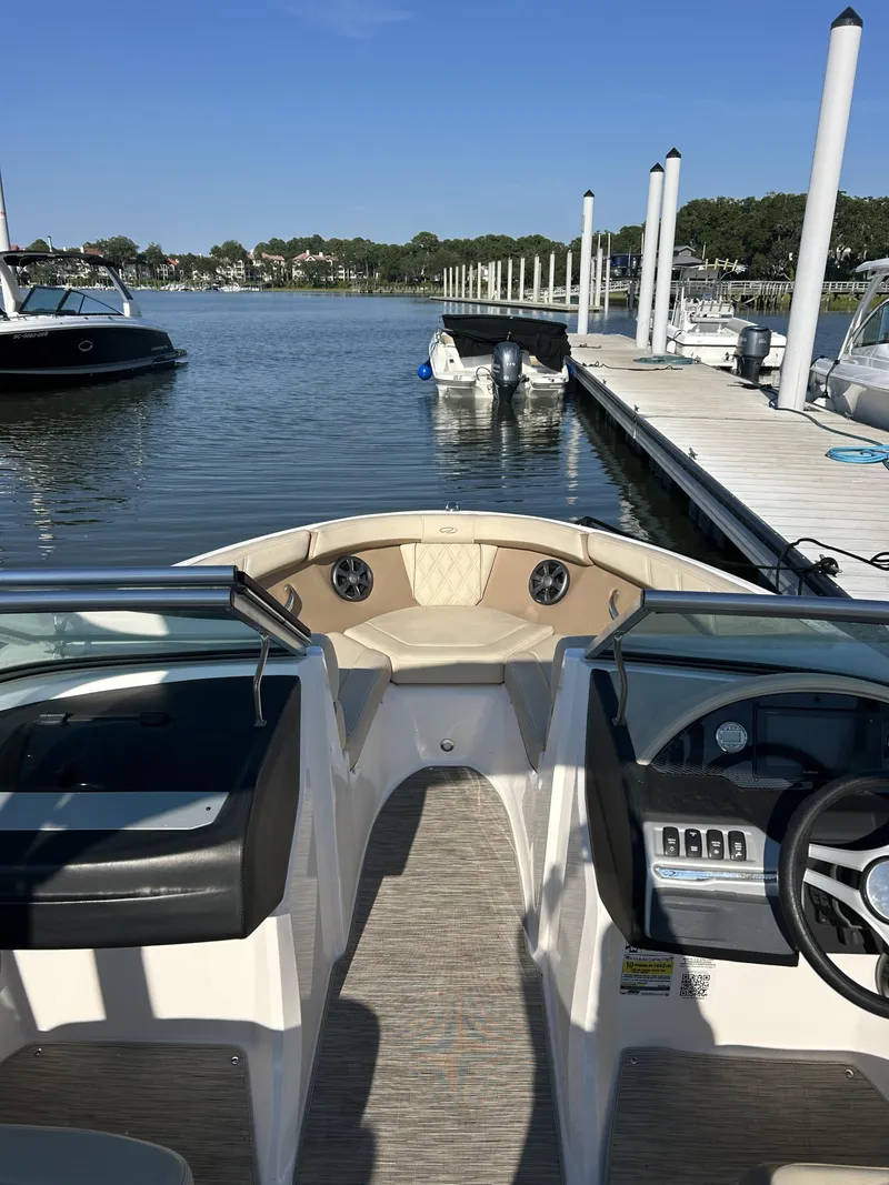 Slide: The Image of Interior view of a 2019 Regal 210 OBX boat at the dock. - 3