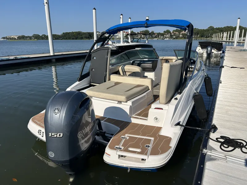 Slide: The Image of 2019 Regal 210 OBX boat docked with Yamaha engine. - 5