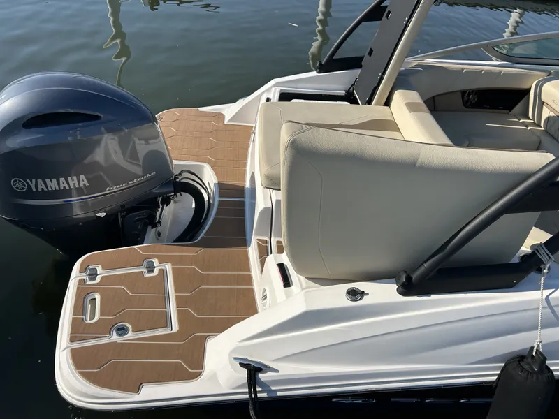 Slide: The Image of 2019 Regal 210 OBX with Yamaha outboard motor on water. - 7