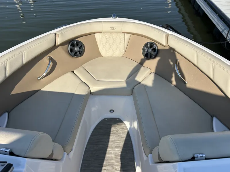 Slide: The Image of Interior of a 2019 Regal 210 OBX boat with beige seating. - 8