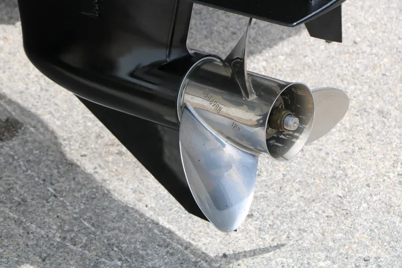 Slide: The Image of Close-up of a 2018 Tahoe 450 TF boat propeller on concrete surface. - 15