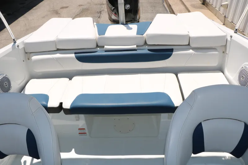 Slide: The Image of 2018 Tahoe 450 TF boat interior with white and blue seating, showcasing spacious design. - 31