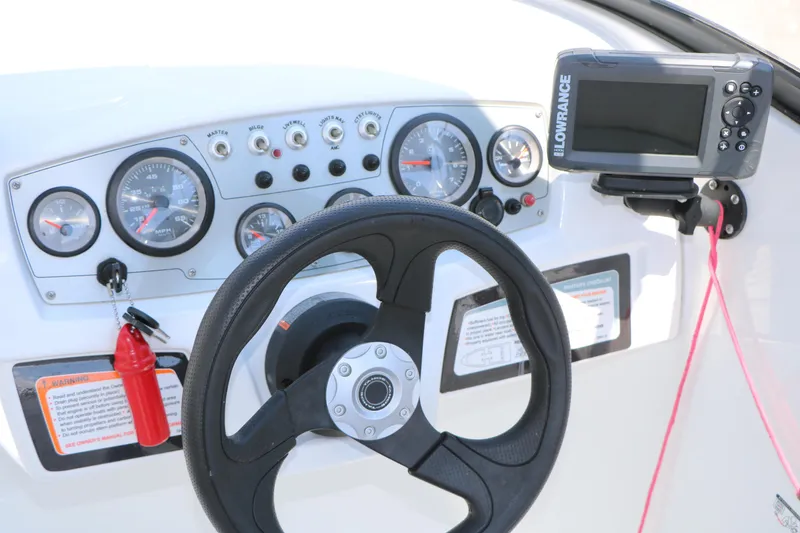 Slide: The Image of Steering console of 2018 Tahoe 450 TF boat with gauges and navigation system. - 34