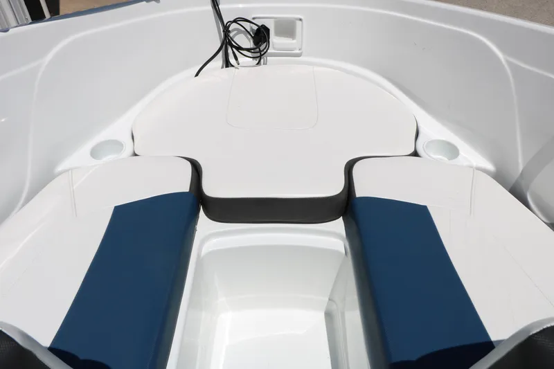 Slide: The Image of 2018 Tahoe 450 TF boat interior with blue and white seating. - 37