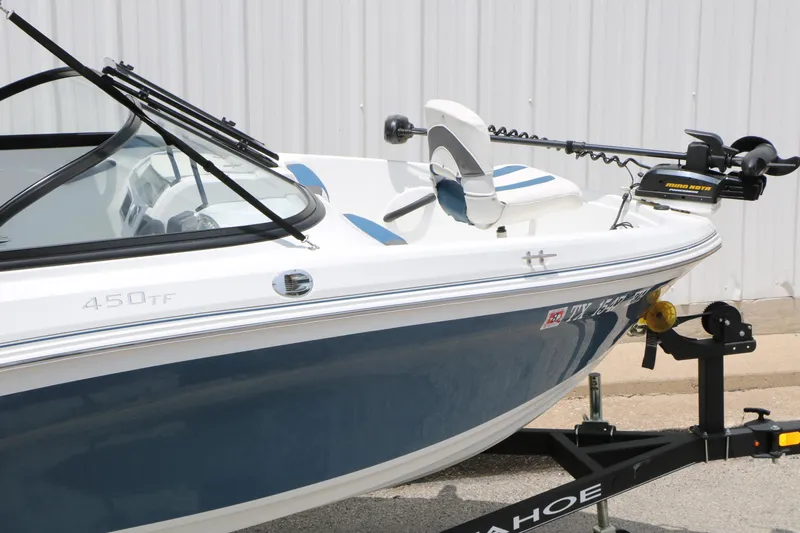 Slide: The Image of 2018 Tahoe 450 TF boat on trailer, featuring sleek design and modern equipment. - 7