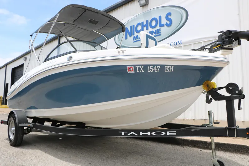 Slide: The Image of 2018 Tahoe 450 TF boat on trailer at Nichols Marine dealership. - 9