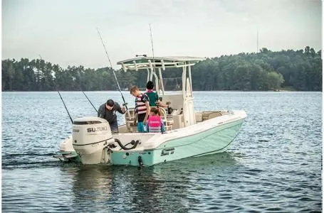 Slide: The Image of 2023 Carolina Skiff 23 Ultra Elite on a serene lake. - 6