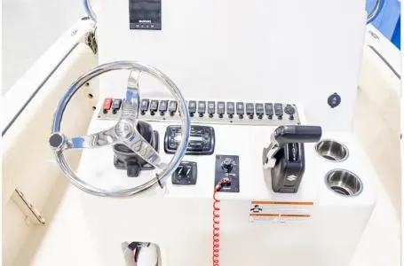 Slide: The Image of 2023 Carolina Skiff 23 Ultra Elite helm console with controls. - 7