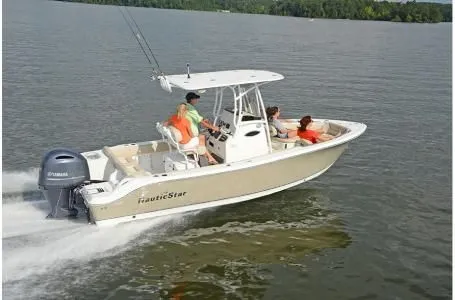 The Image of 2019 NauticStar 2302 Legacy boat cruising on calm water. - 1