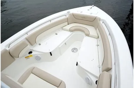 Slide: The Image of 2019 NauticStar 2302 Legacy boat with beige seating area. - 10