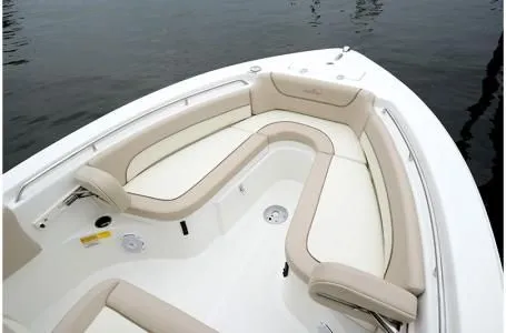Slide: The Image of 2019 NauticStar 2302 Legacy boat with beige seating area. - 15
