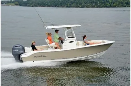 Slide: The Image of 2019 NauticStar 2302 Legacy boat on the water. - 19