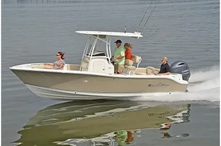 Slide: The Image of 2019 NauticStar 2302 Legacy boat on calm water. - 2