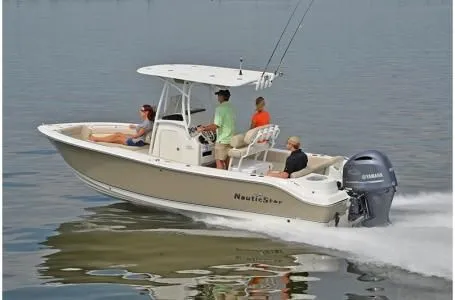 Slide: The Image of 2019 NauticStar 2302 Legacy boat on calm water. - 26