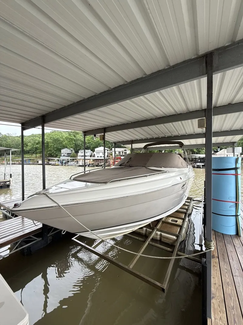 Slide: The Image of 2005 Regal 2900 BR boat in covered dock. - 11
