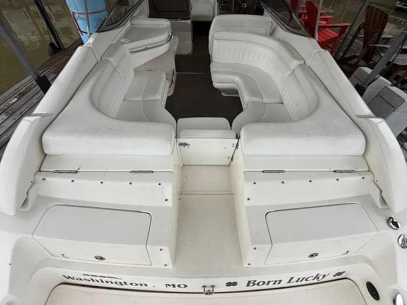Slide: The Image of Interior of a 2005 Regal 2900 BR boat with white seating. - 14