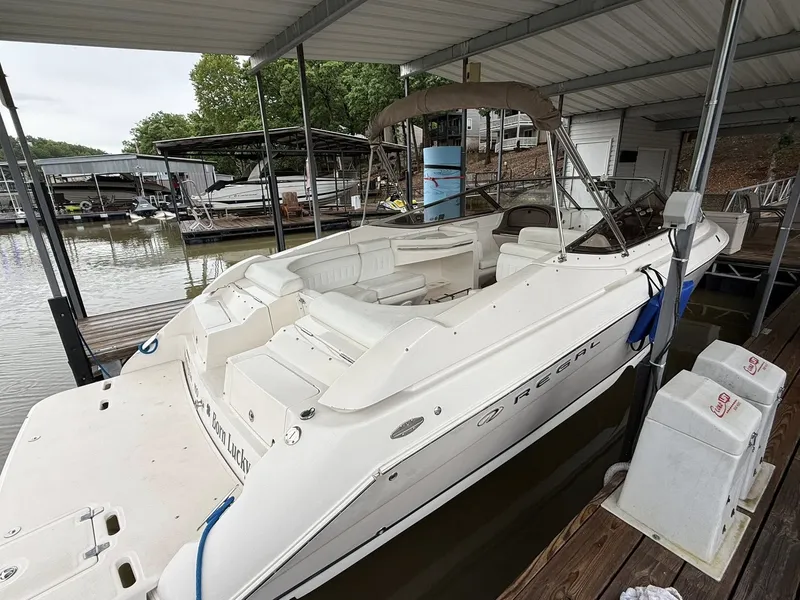 Slide: The Image of 2005 Regal 2900 BR boat docked, white interior. - 16