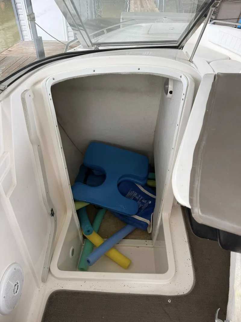 Slide: The Image of Storage compartment in Regal 2900 BR boat with pool noodles, 2005 model. - 17