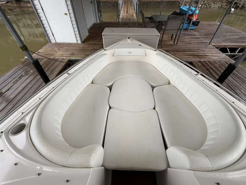 Slide: The Image of Regal 2900 BR 2005 boat with white seating area at dock. - 4