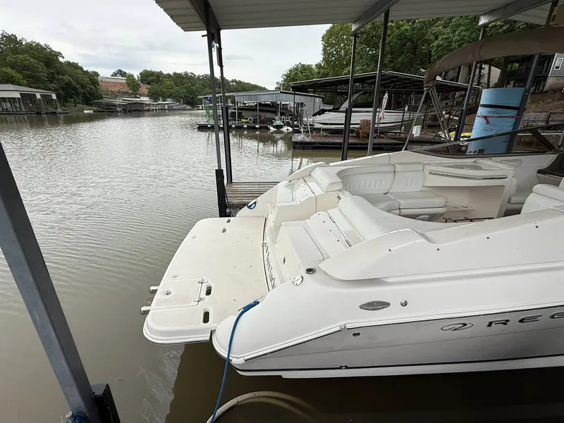 Slide: The Image of 2005 Regal 2900 BR boat docked, calm waters. - 6