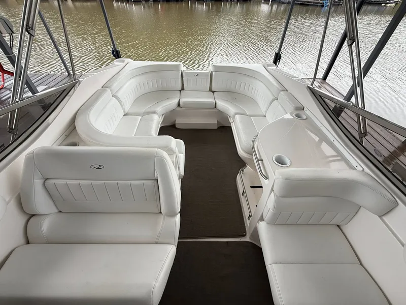 Slide: The Image of Interior of a 2005 Regal 2900 BR boat with white leather seating. - 7
