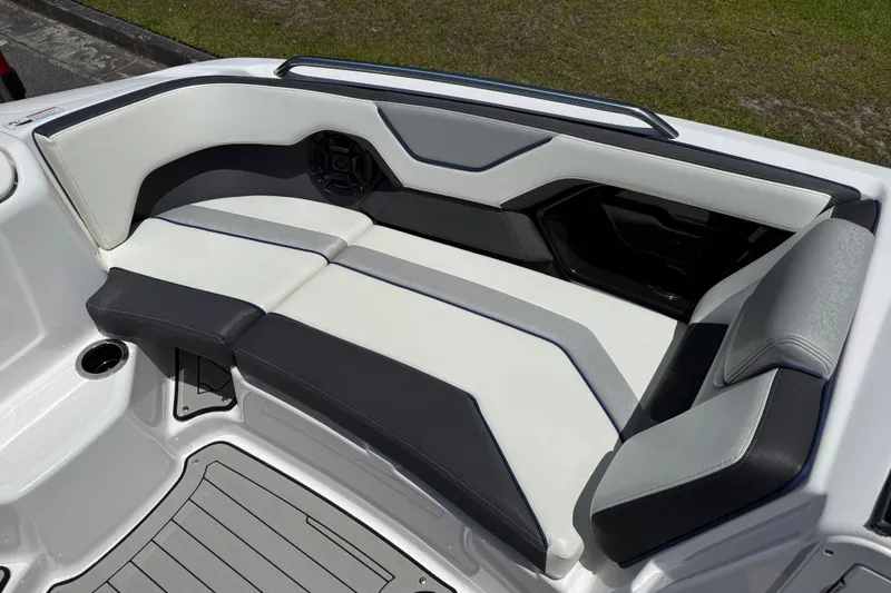 Slide: The Image of 2020 Yamaha Boats 212S interior seating with sleek, modern design and comfortable upholstery. - 13