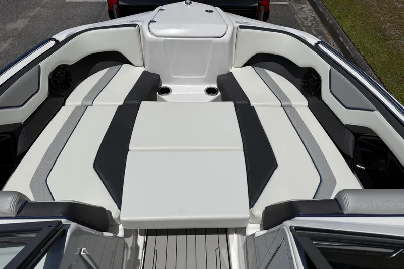 Slide: The Image of 2020 Yamaha Boats 212S interior with spacious seating and modern design. - 14